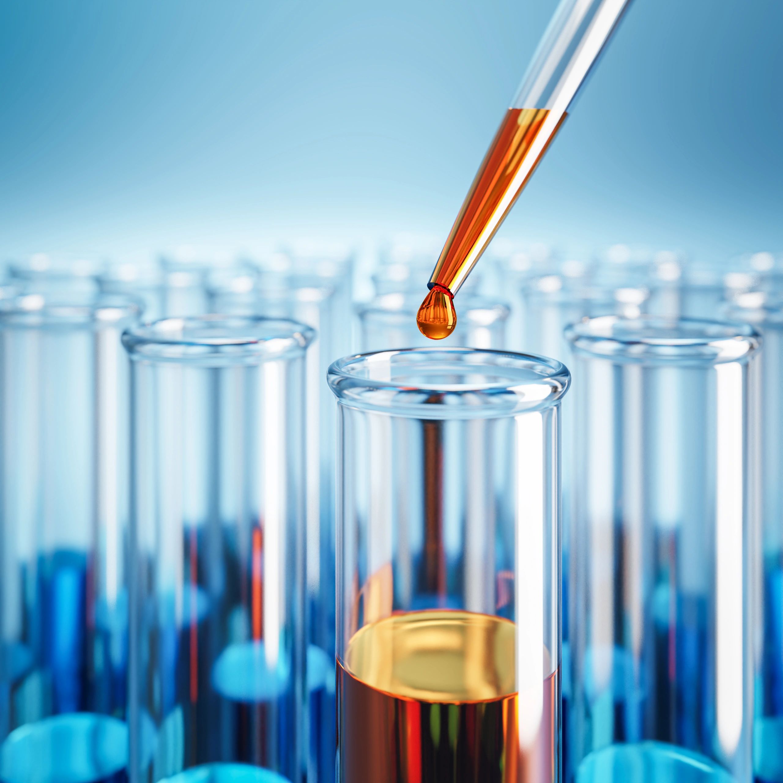 Laboratory testing with orange and blue liquids