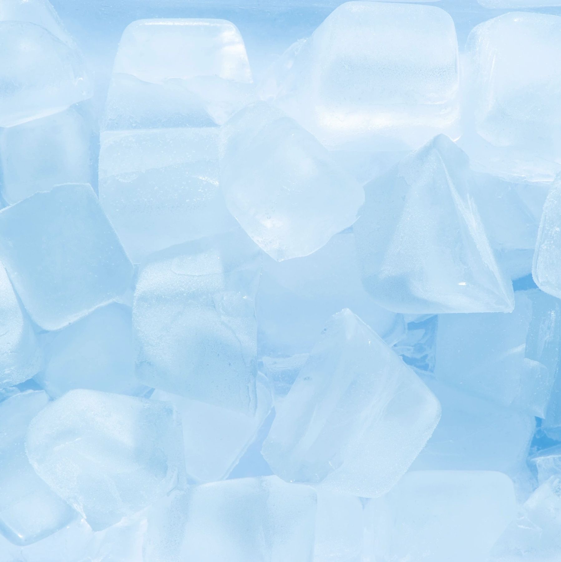 Close-up of translucent ice cubes with a blue tint